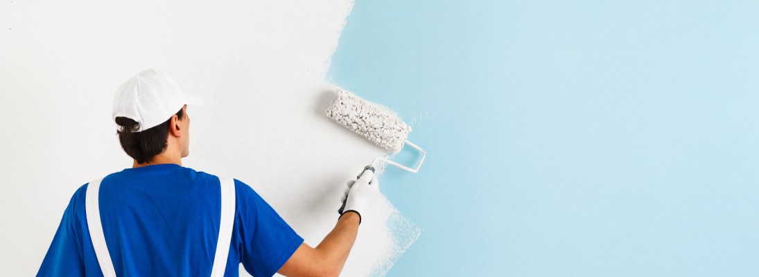 Construction worker assemble a suspended ceiling with drywall and fixing the drywall to the ceiling metal frame with screwdriver. Renovation, construction and ceiling installation concept.