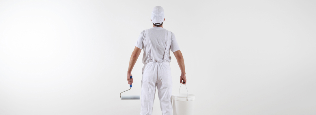 Construction worker assemble a suspended ceiling with drywall and fixing the drywall to the ceiling metal frame with screwdriver. Renovation, construction and ceiling installation concept.